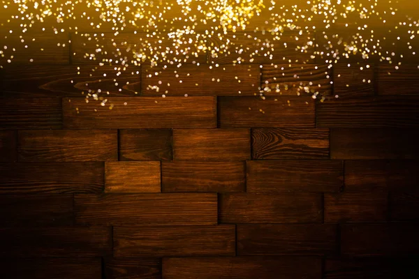 在圣诞节前的木板上 木制的乡村背景上闪烁着温暖的金色花环灯 闪闪发光的覆盖物 — 图库照片