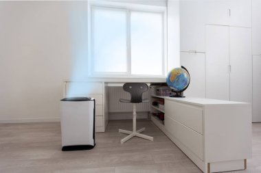 A modern humidifier in the childrens bedroom. Maintaining the climate in the apartment.