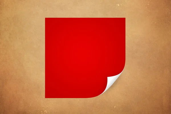 Red paper with curled corner. — Stock Photo, Image