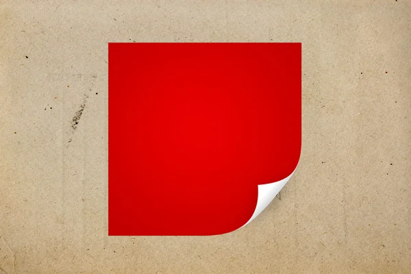 Red paper with curled corner. — Stock Photo, Image