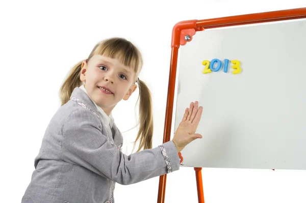 Little girl teaching near board in studio — Stock Photo, Image