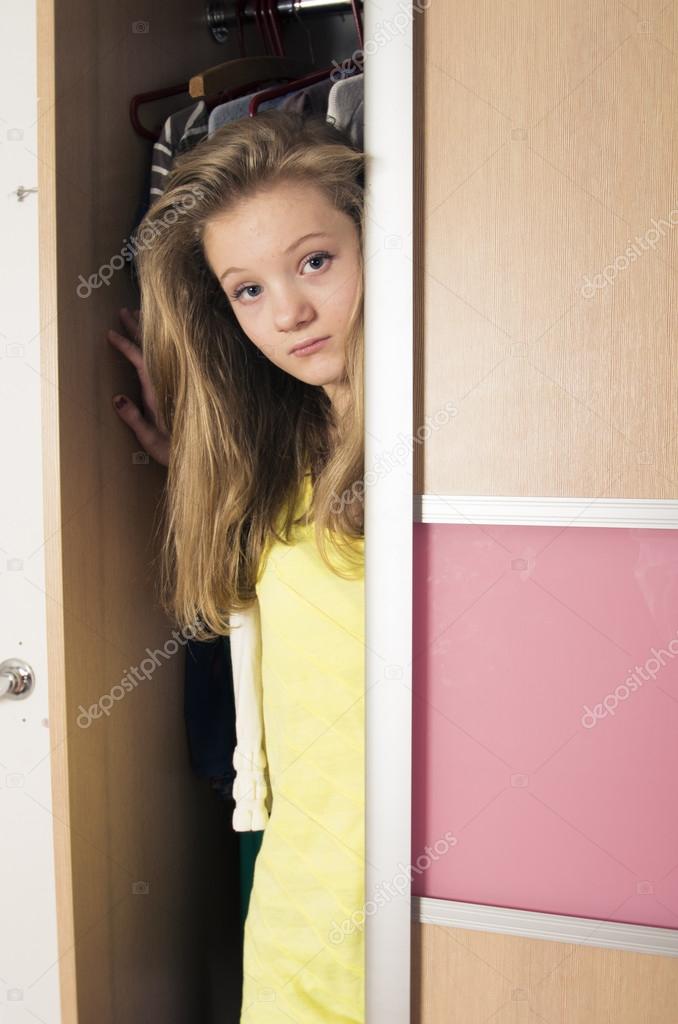 Teenage girl in wardrobe at home