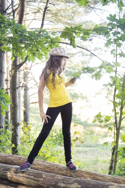 Young nice girl posing in the forest — Stock Photo, Image