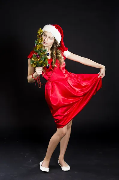 Leuke tiener meisje in santa claus kostuum — Stockfoto