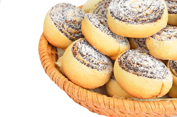 Homemade cookie roll with poppy in a wattled basket — Stock Photo, Image