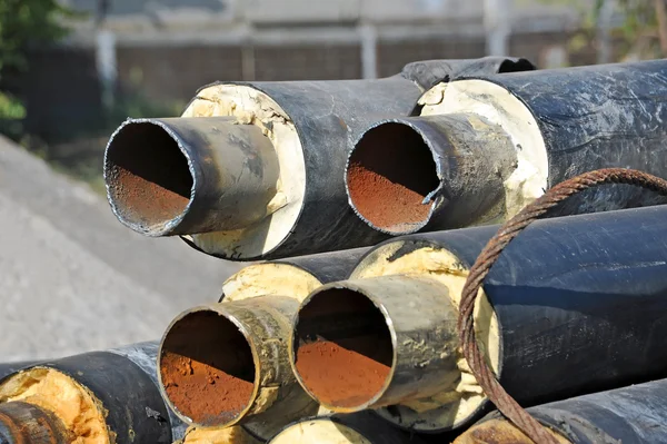 Rusty steel pipe with heat insulation — Stock Photo, Image