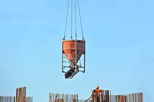 Crane lifting cement mixing container — Stock Photo, Image