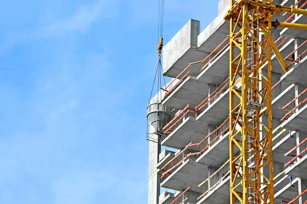 Crane lifting cement mixing container — Stock Photo, Image