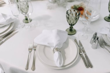 The table is set for the celebration with beautiful glasses