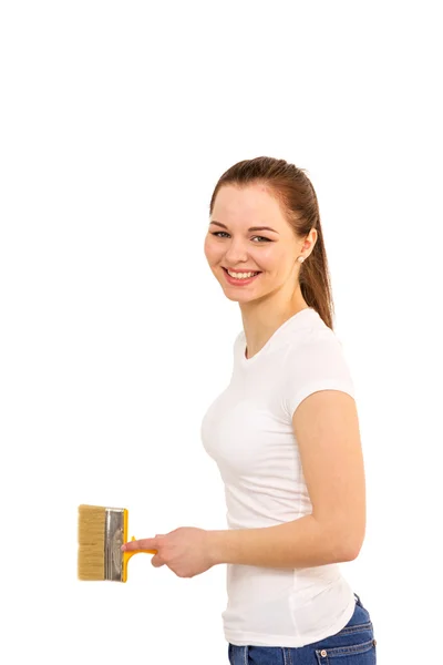 The beautiful girl with brush in hand it is isolated on the whit — Stock Photo, Image