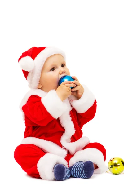 Small Santa with toys and spheres in hands — Stock Photo, Image