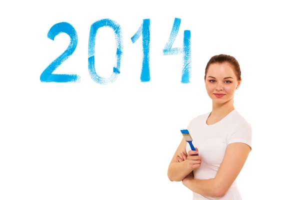 Beautiful young girl writes date on the white — Stock Photo, Image