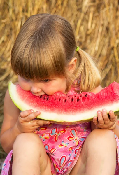 Portrait of the child who eats sweet water-melon — Stock Photo, Image