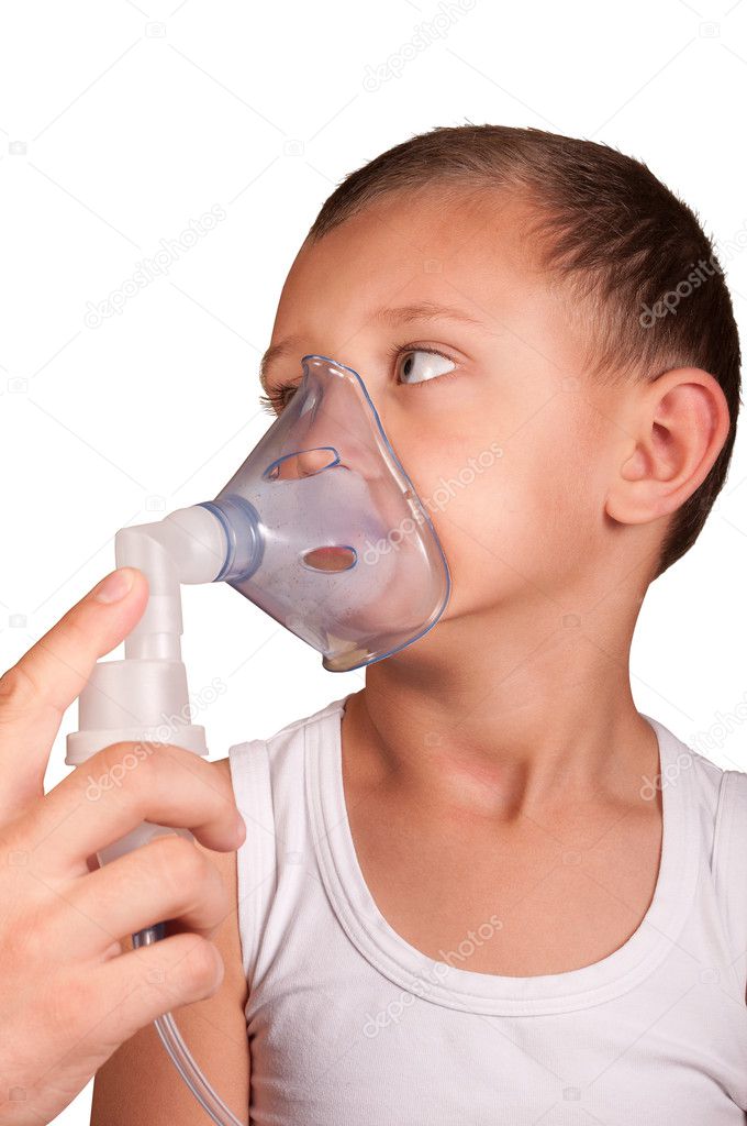 Little boy in the mask of the inhaler