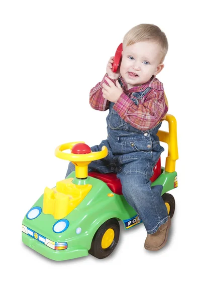 Мальчик звонит на игрушечный телефон — стоковое фото