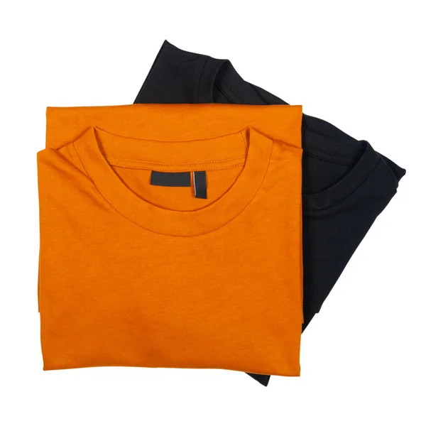 两件男性折叠的T恤衫 橙色和黑色 白色隔离 — 图库照片