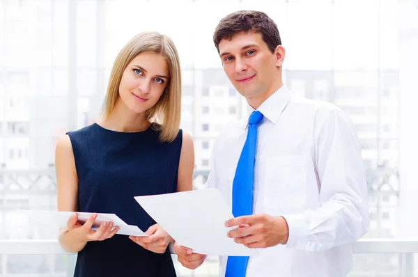 Business man and business woman in the office to discuss reports — Stock Photo, Image