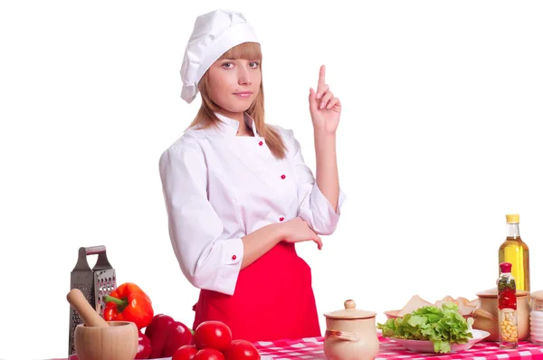 Mulher cozinheiro atraente um fundo sobre branco — Fotografia de Stock