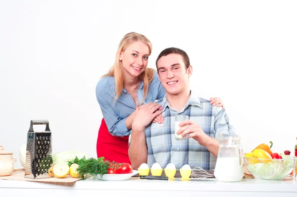 Wife gives her husband a meal Royalty Free Stock Images