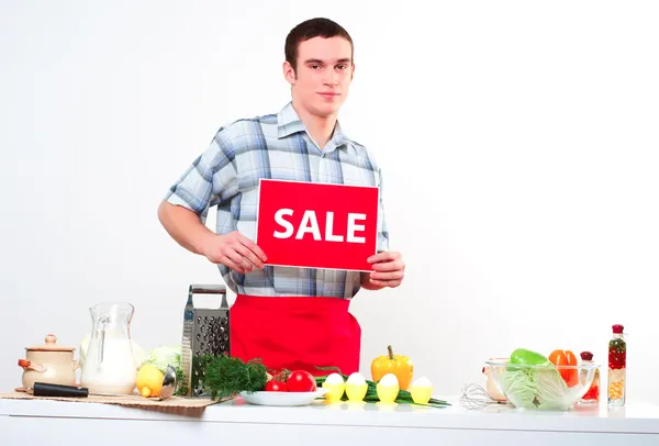 Portrait of a young man, hold sale mark — Stock Photo, Image