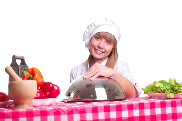 Atractiva mujer cocinera un fondo sobre blanco — Foto de Stock