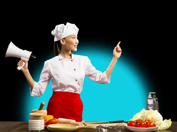 Asian female chef holding a megaphone — Stok fotoğraf