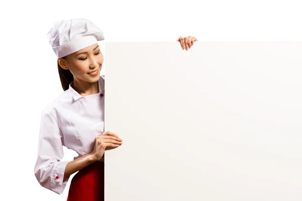 Female chef holding a poster for text — Stock Photo, Image