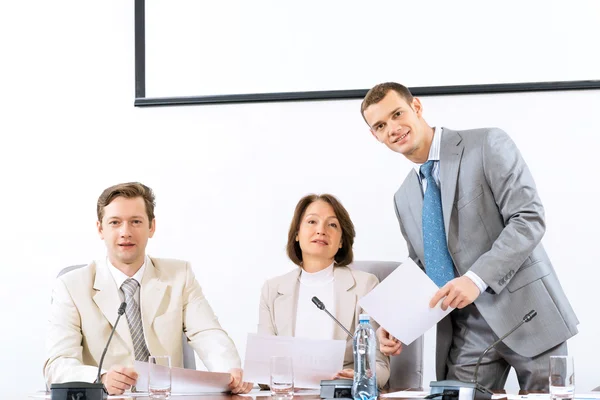 Group of business discussing documents — Stock Photo, Image