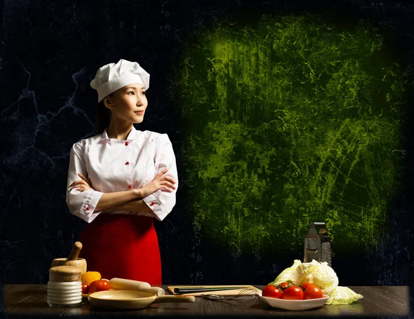 Asian female chef looking at the empty space — Stock Photo, Image