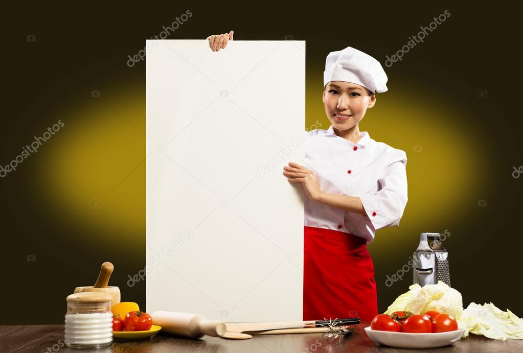 Female chef holding a poster for text