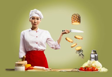 Asian female chef cuts pineapple clipart