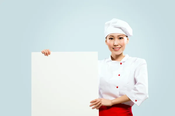 Asian female chef holding poster for the text — Stock Photo, Image