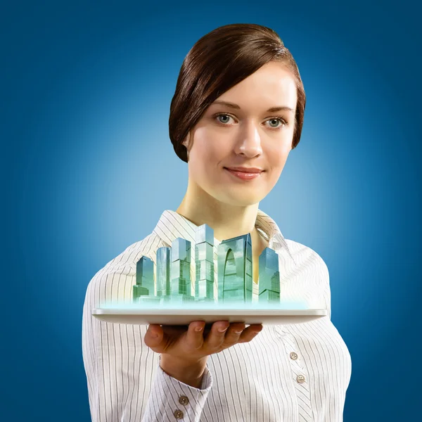 Young businesswoman with business buildings model — Stock Photo, Image