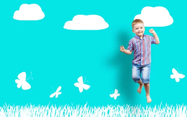 boy jumping on the background of painted wall