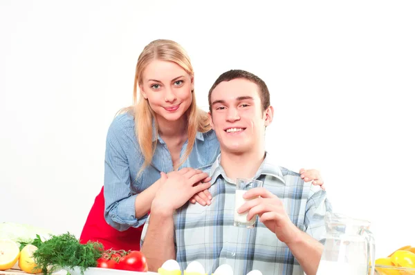 Wife gives her husband a meal Stock Photo