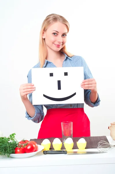 Mulher cozinheiro atraente um fundo sobre branco — Fotografia de Stock