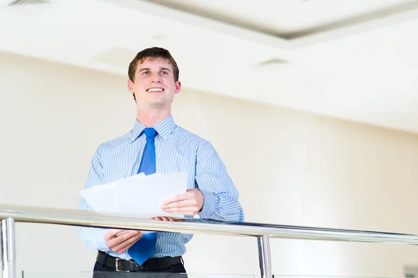 Portrait of a businessman with documents in his hands — Stock Photo, Image