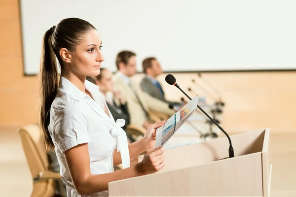 Portrait of a business woman with microphone — Stock Photo, Image