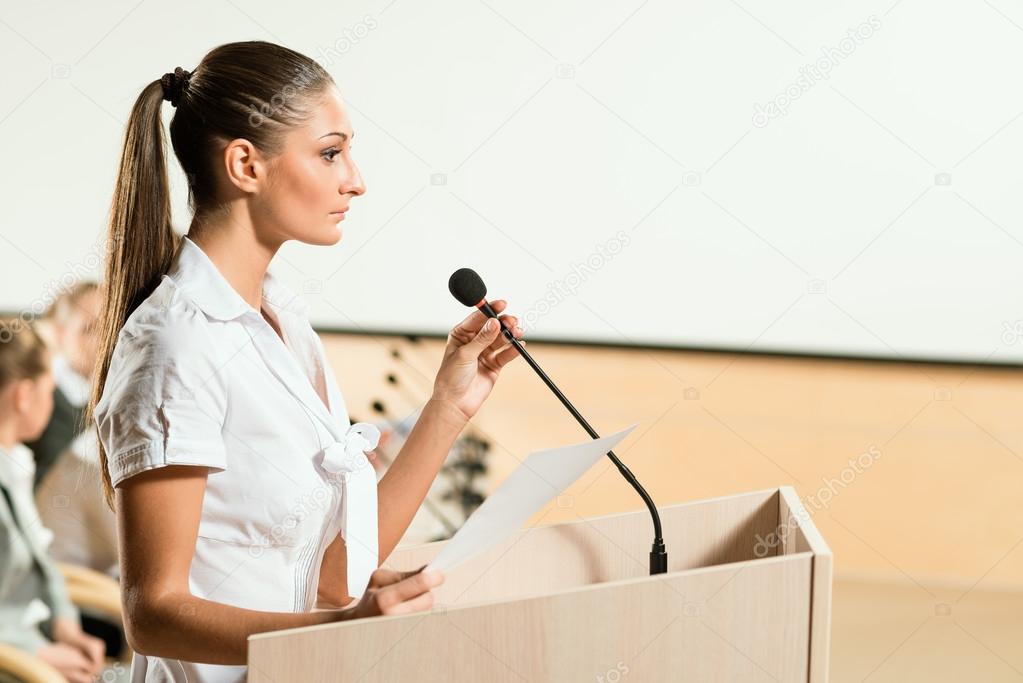 Portrait of a business woman with microphone