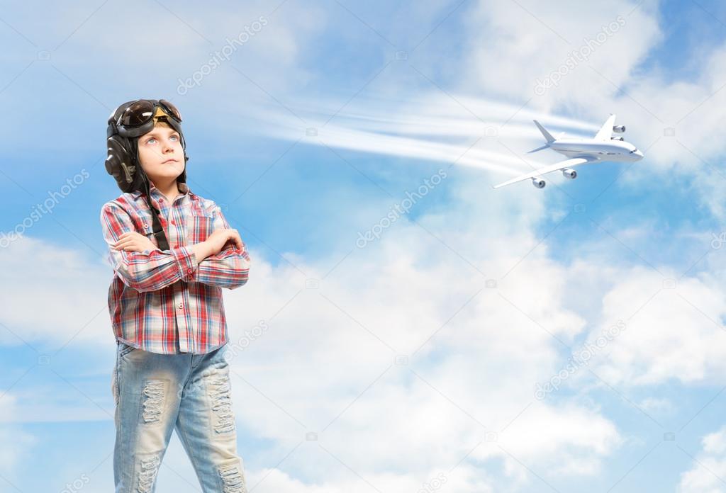 Boy in helmet pilot dreaming of becoming a pilot