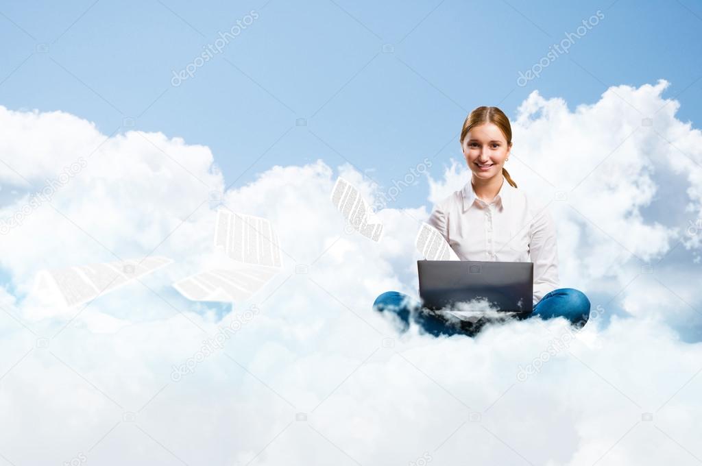 young girl running in the clouds with a laptop