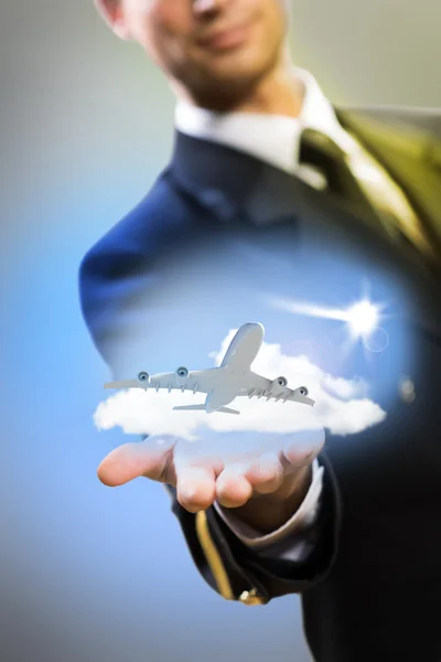 Pilot in the form of extending a hand to airplane — Stock Photo, Image