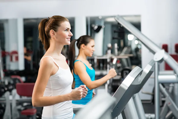 Women running on a treadmill — Stock Photo, Image