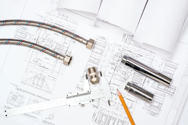 Plumbing and drawings, construction still life — Stock Photo, Image