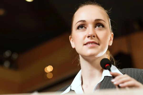 Portrait of a business woman with microphone — Stock Photo, Image