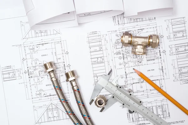 Plumbing and drawings, construction still life — Stock Photo, Image