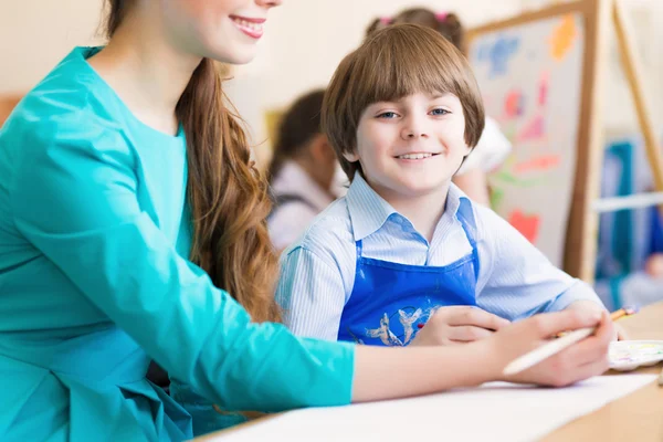 Teacher and student in the classroom — Stock Photo, Image