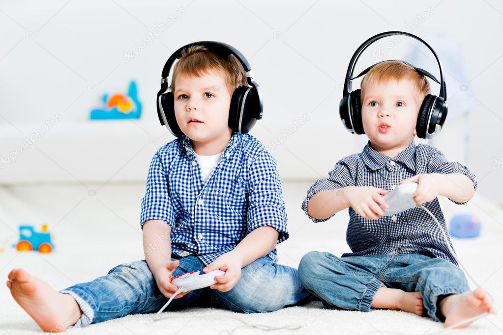 two brothers playing on a games console