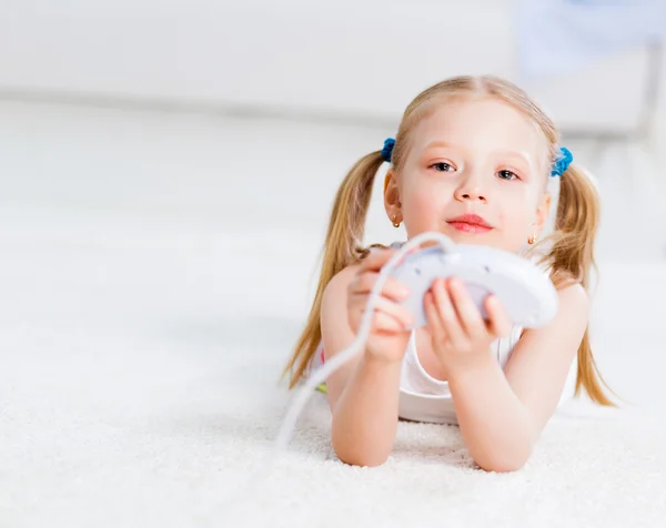 Girl playing on a game console — Stock Photo, Image