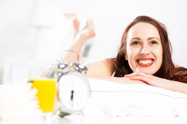 Portrait of a young woman in the bedroom — Stock Photo, Image